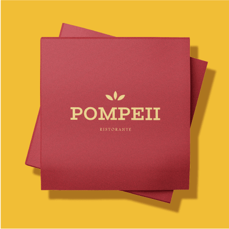A red textured napkin with the logo 'POMPEII Ristorante' printed in gold lettering, featuring a simple leaf emblem above the text, set against a yellow background.