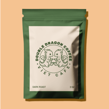 A green and cream coffee bag labeled 'Double Dragon Coffee Viet Cafe' with an illustration of two cartoon-style dragons facing each other.