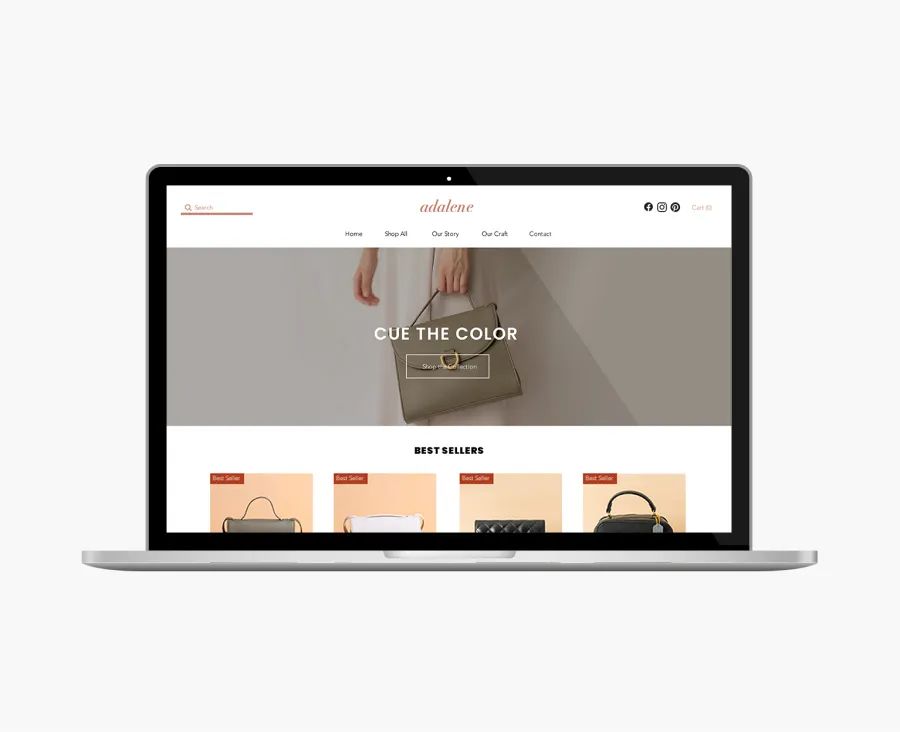 Open laptop displaying a handbag ecommerce website