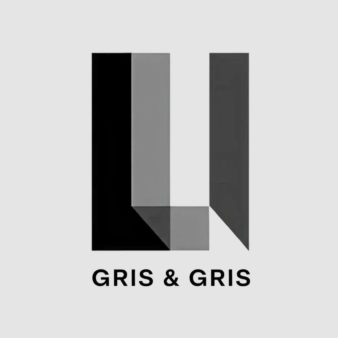 Logo géométrique minimaliste en noir et gris, évoquant le design moderne et la création visuelle.