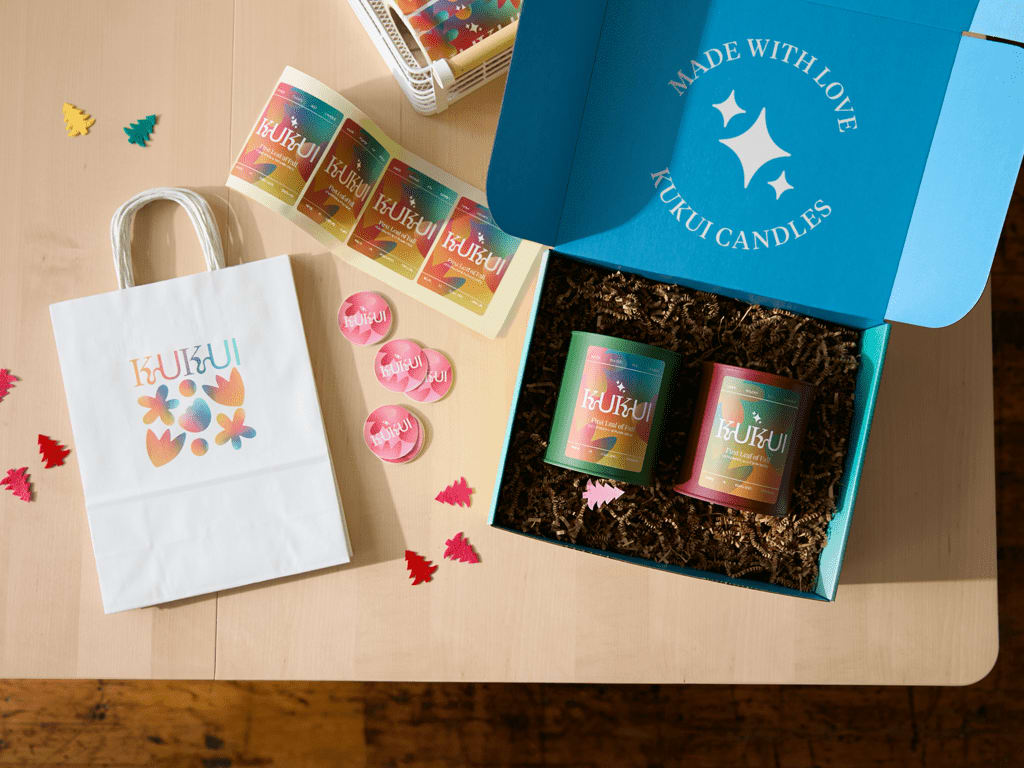Branded candles in a holiday gift box