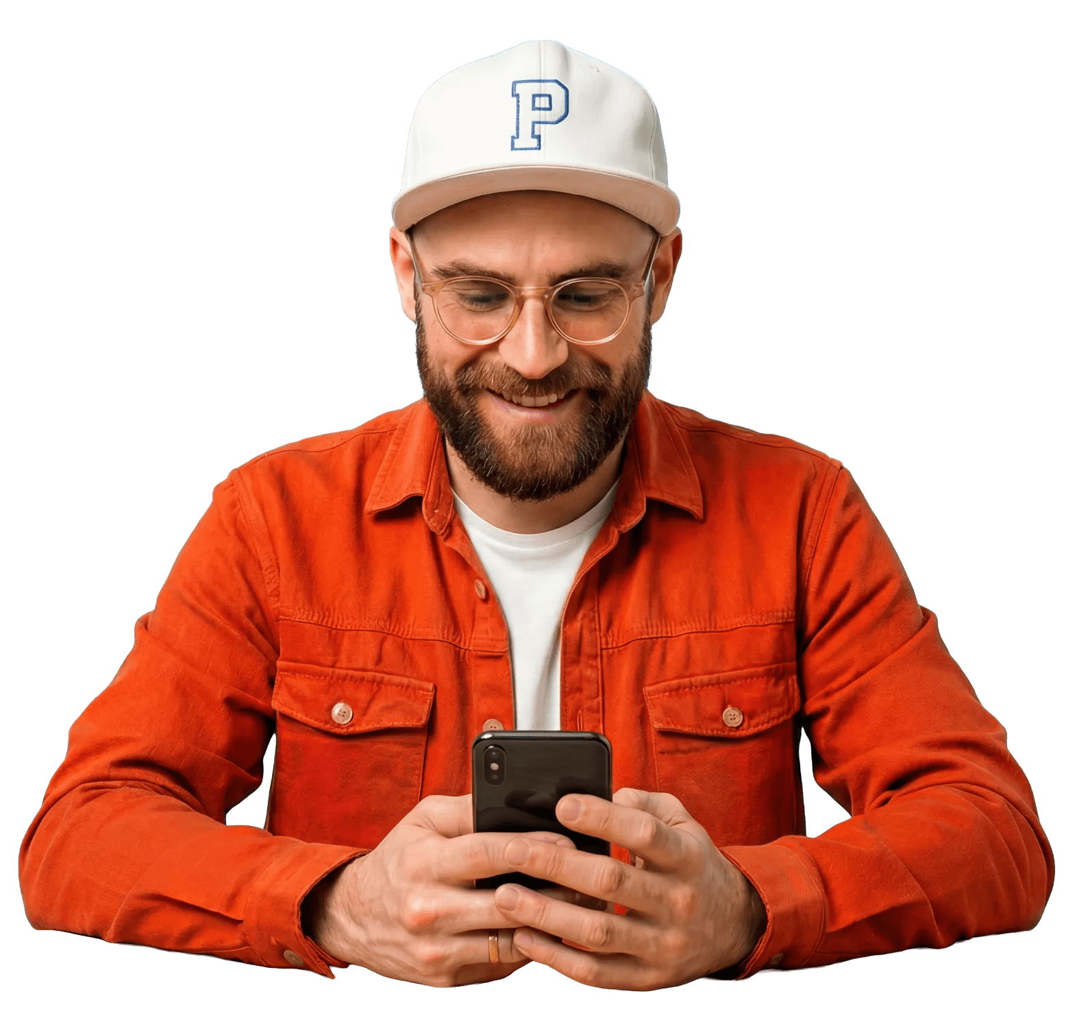 A man smiling at his phone while creating a pet store logo.