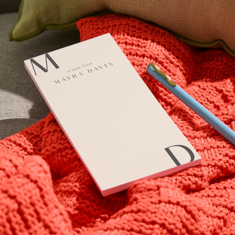 A personalised notepad with a space-themed design.