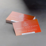 A stack of glossy business cards for a yoga studio.