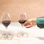 Two wine glasses personalised for a wedding.