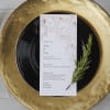 wedding dinner party menu with white and rose gold flowers