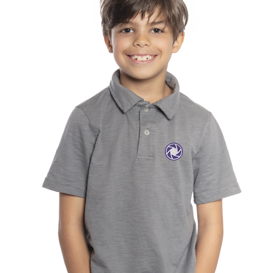 A child wearing a personalized heather gray polo shirt. 
