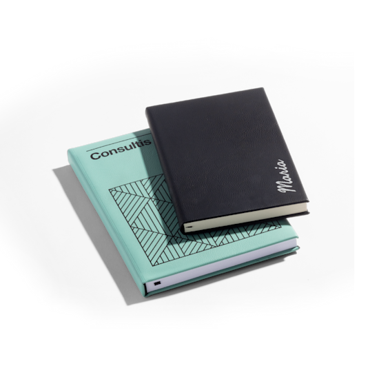 A pair of Faux Leather journals, the smaller one belongs to a girl named Maria, and the larger one is promoting a consulting business