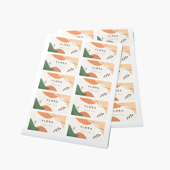 Two overlapping sheets of business card stickers promoting a florist business