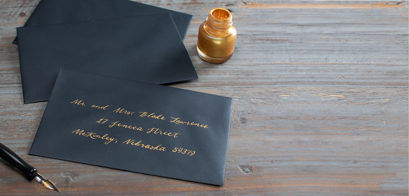 navy envelopes with gold writing