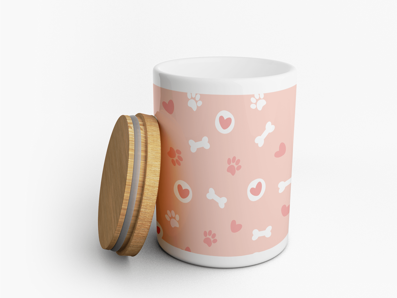 Eine Leckerlidose aus Keramik in Rosa und Weiß gestaltet mit Hundeknochen, Pfotenabdrücken und Herzen.