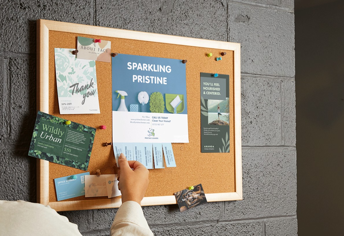 A perforated flyer on a corkboard has multiple tabs missing as people take them to use later.