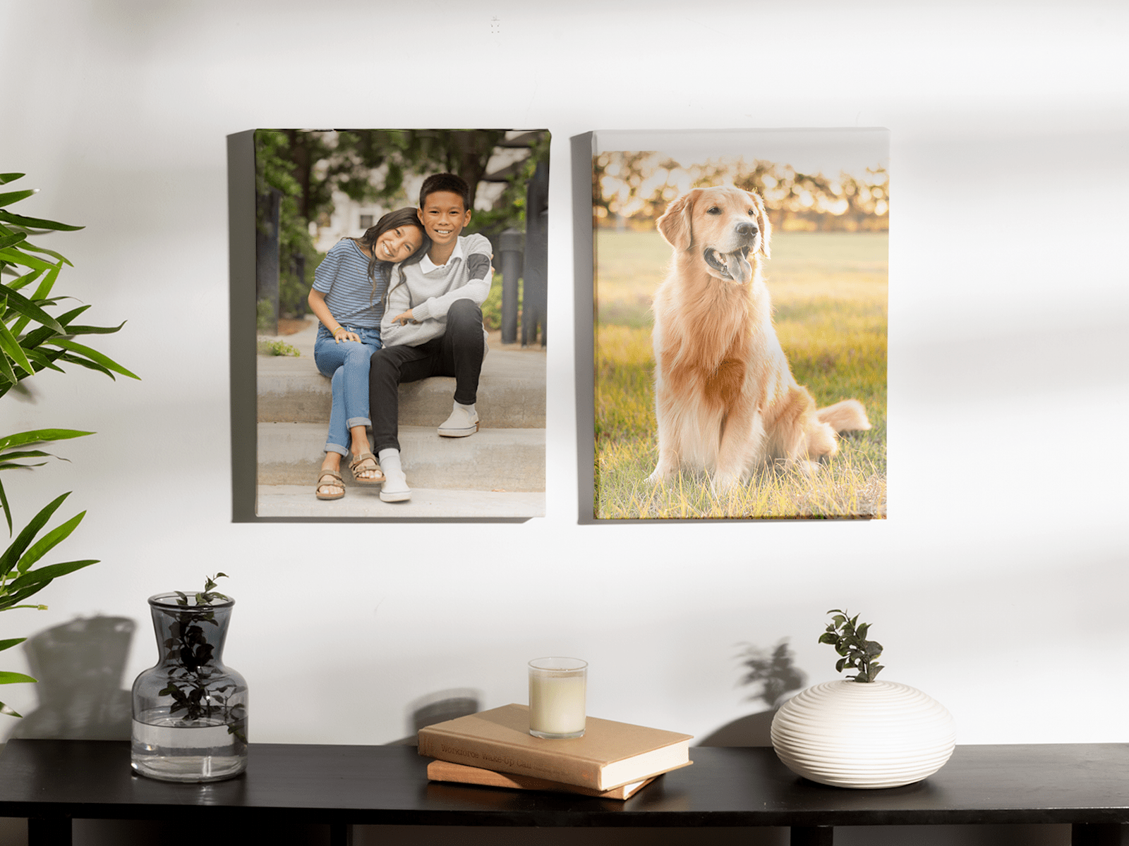 Two photo canvas prints hanging on the wall, one of them showing two kids, the other one is a dog photo 