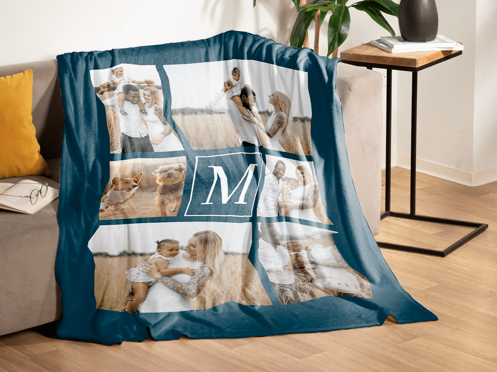 Larger version: A green fleece blanket with six family photos printed on it rests on a couch.