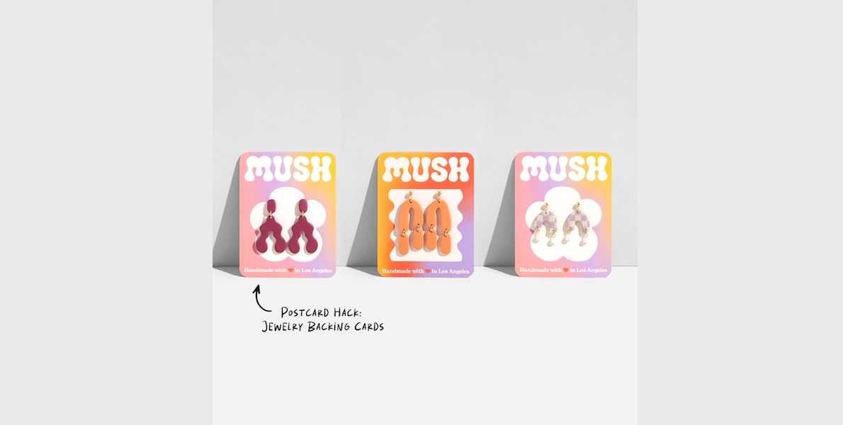 3 similarly designed postcards being used as jewelry backing cards.