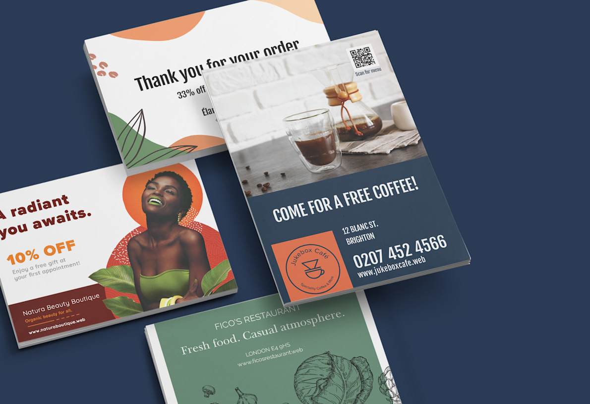 Larger version: Four stacks of personalised postcards showcasing four different businesses. 