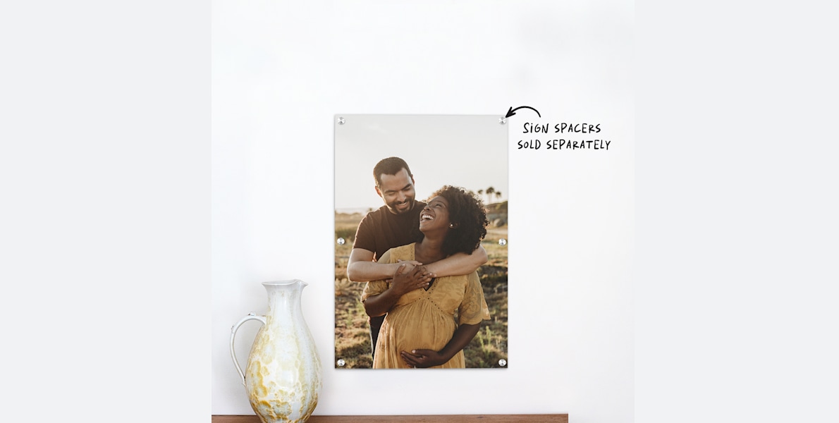 An acrylic print featuring a young couple’s maternity photo. 