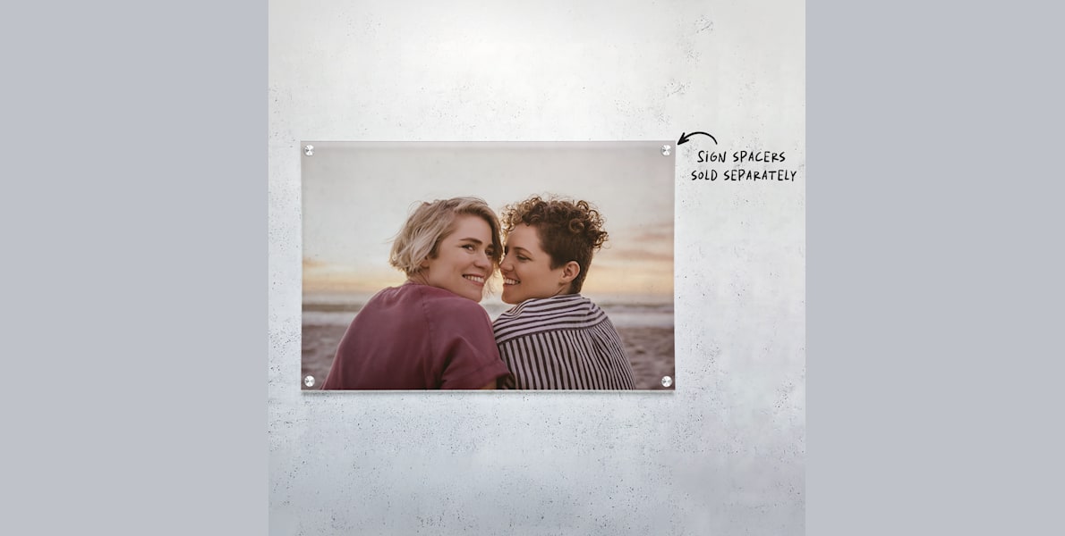 An acrylic print featuring a young couple at the beach. 