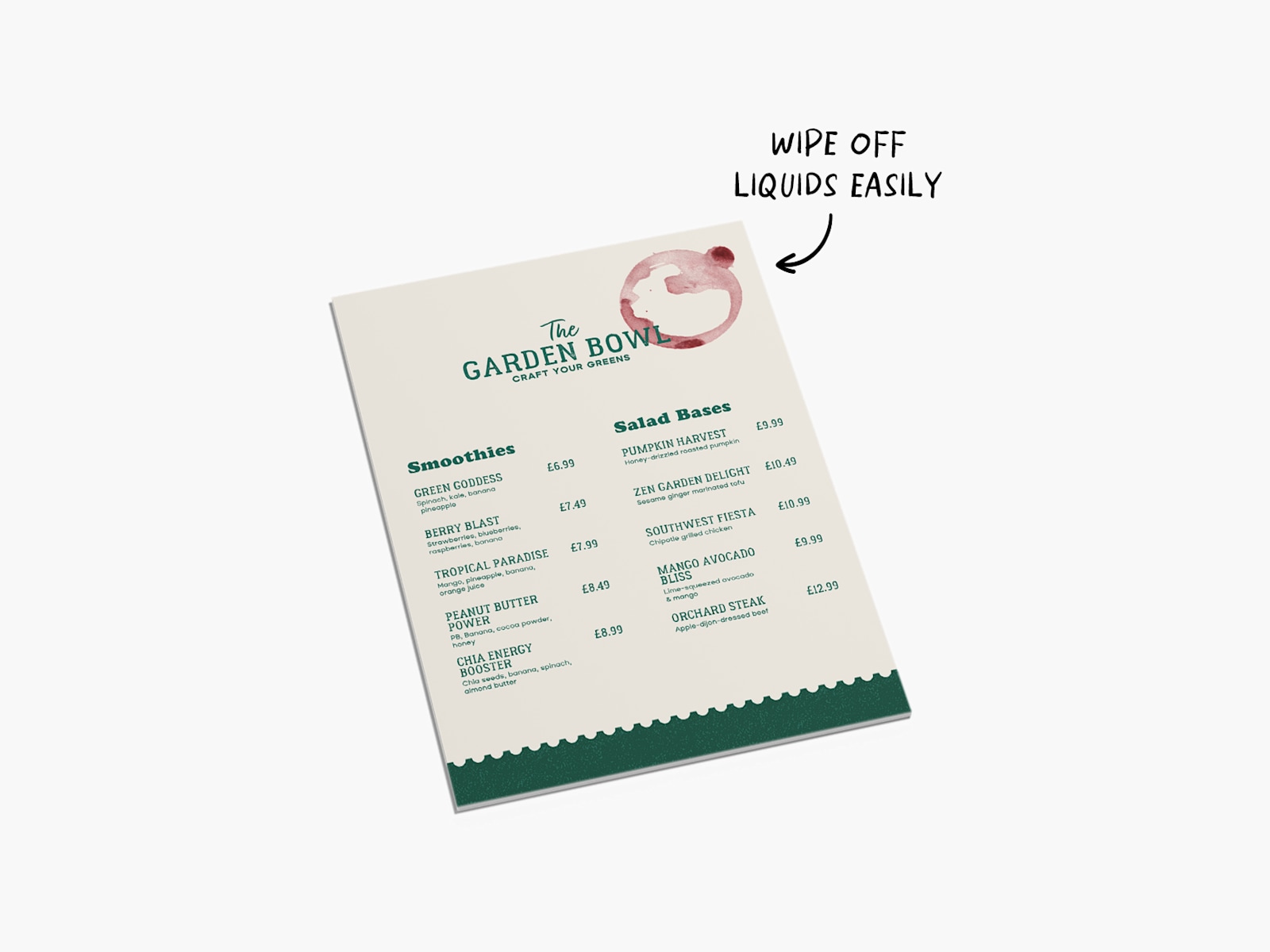 A water-resistant Foamex menu card, undamaged by a small spill, with a note that you can wipe off liquids easily. 