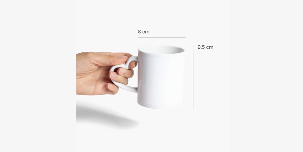A heart-shaped handle mug measured by its size: 8 cm x 9.5 cm.  