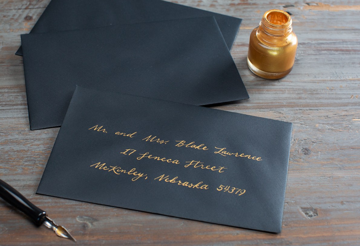 navy envelopes with gold writing