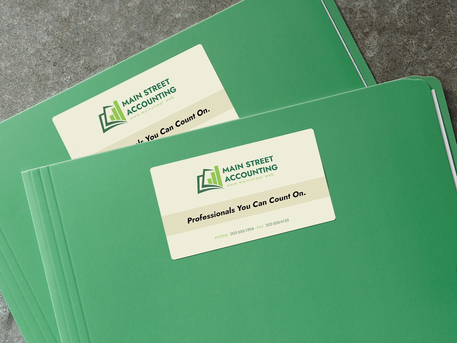 Larger version: A folder with a business card sticker on the front advertising an accounting business.
