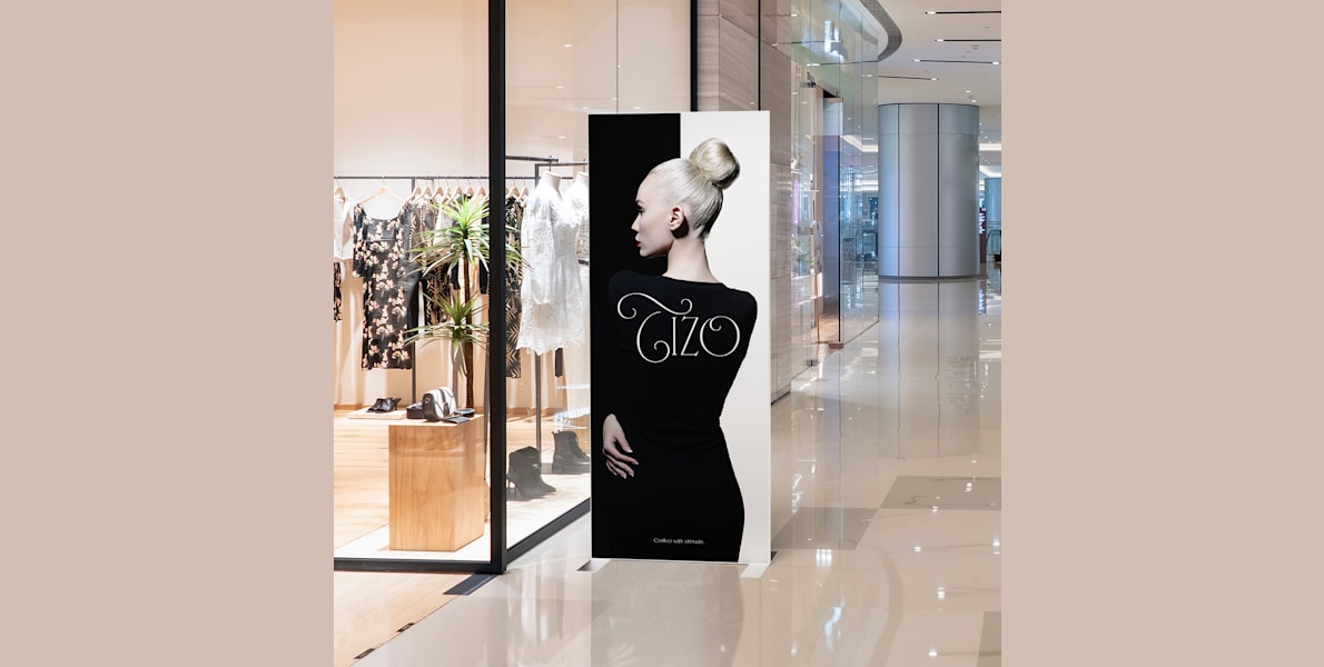 Larger version: A SEG fabric stand shown outside of a boutique.