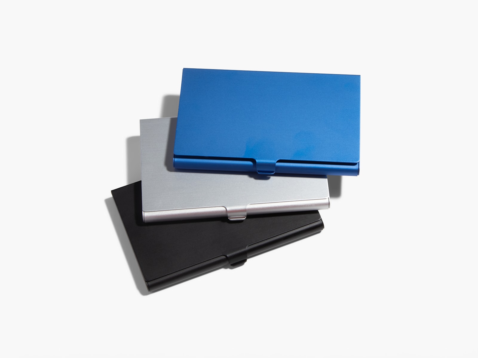 Larger version: Blue, silver and black aluminum business card holders.