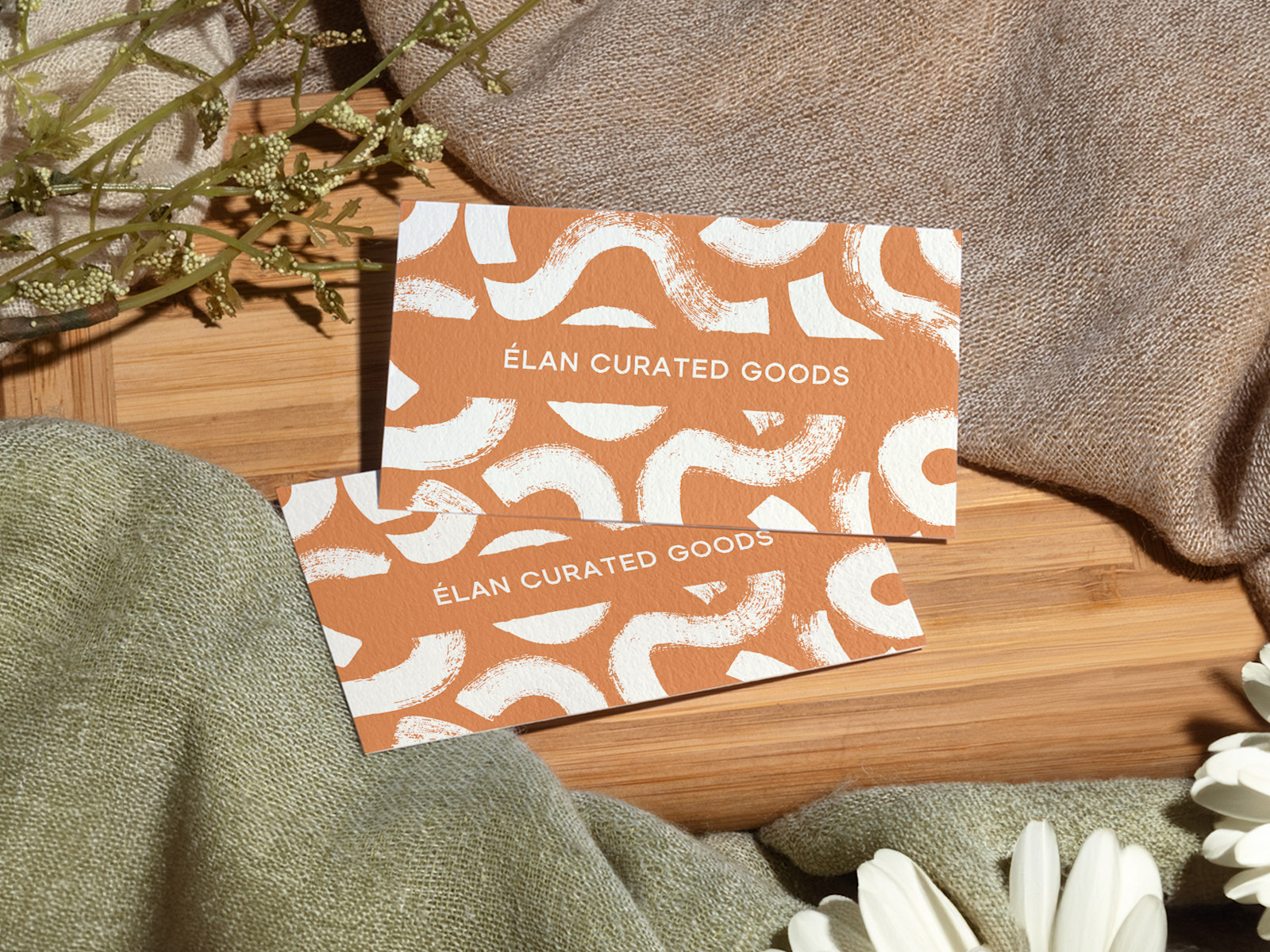 Cotton business cards for a curated goods business.