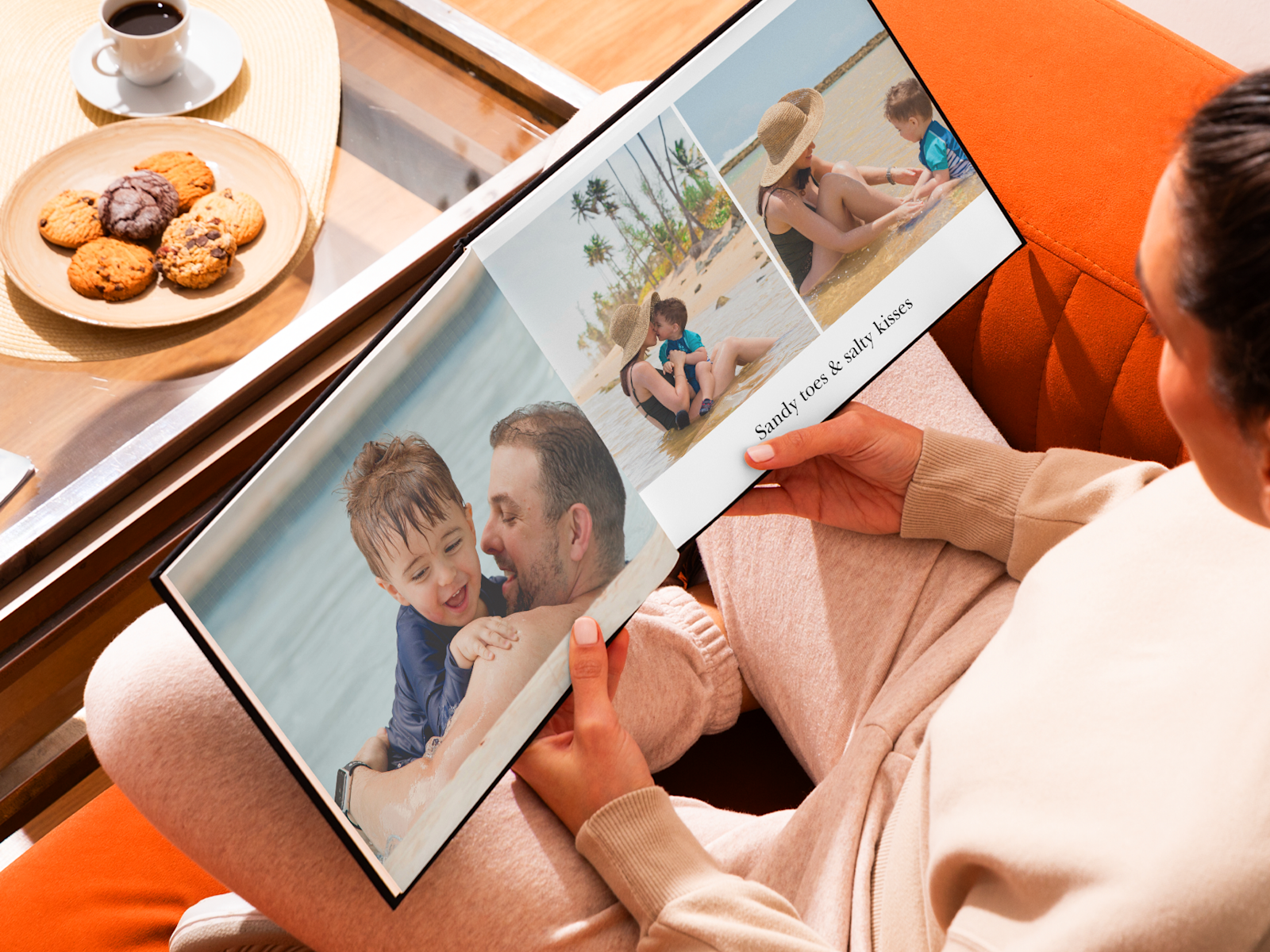 A photo book, open to pictures of a family beach vacation.  