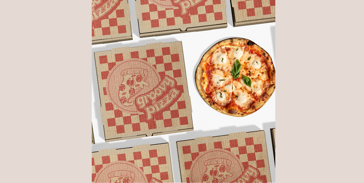 A variety of different branded pizza boxes top side up.
