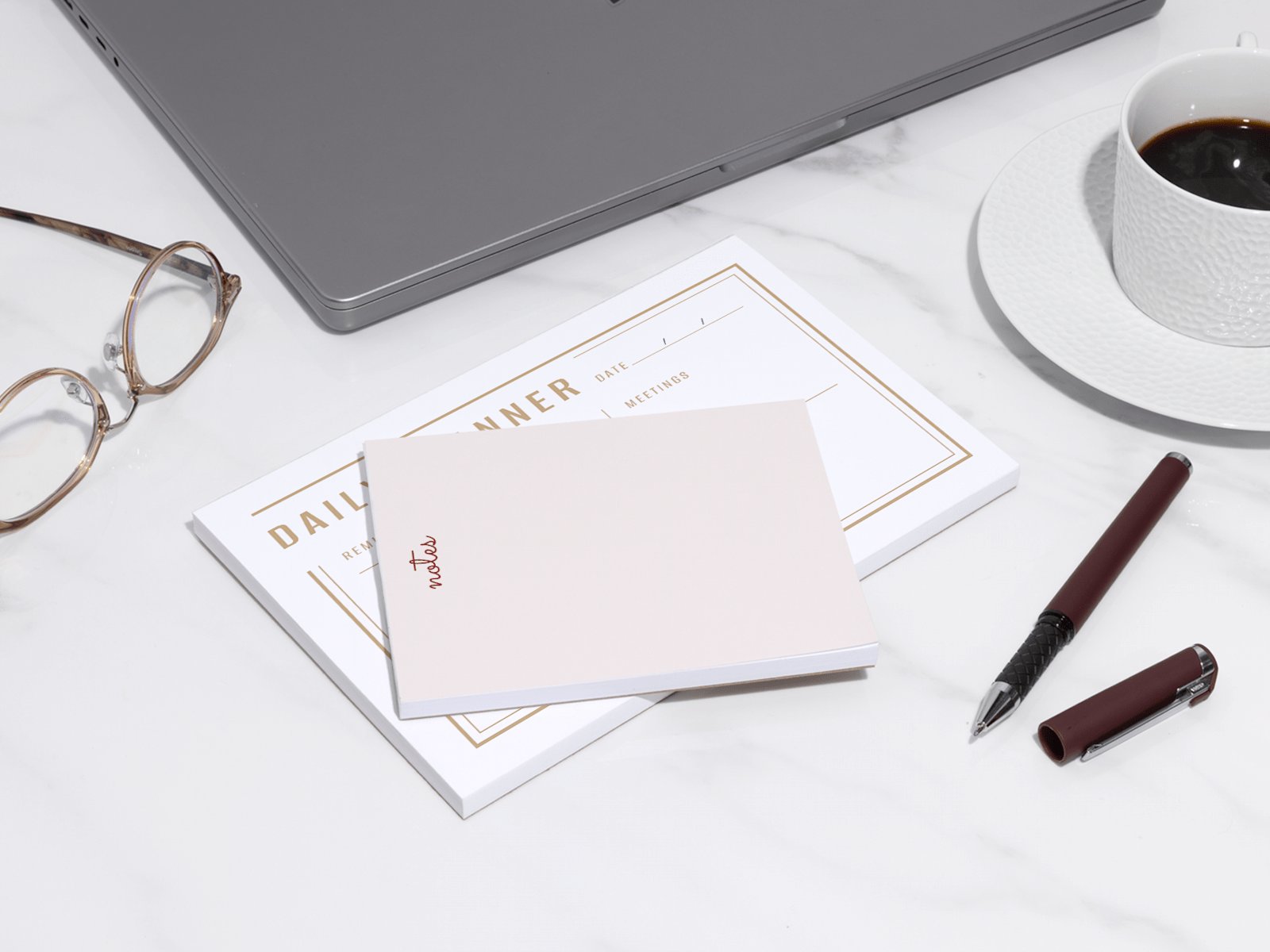 Larger version: Two types of custom notepads sitting on a desk or table.