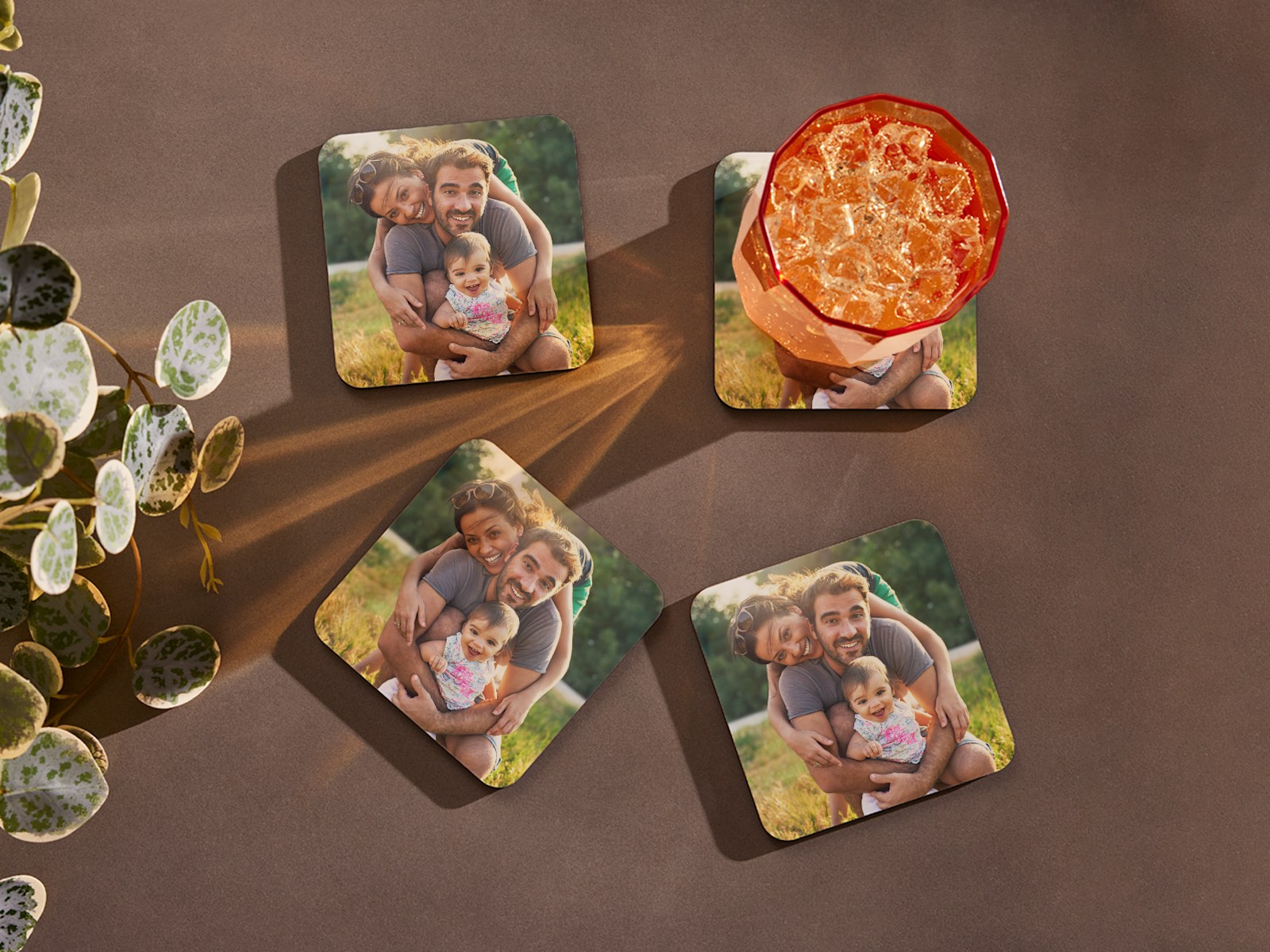 Larger version: Photo coasters featuring a couple and their baby. 