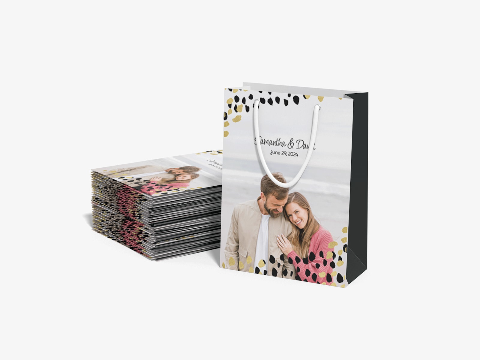 Shows a stack of flattened bags and one bag standing up next to them with a picture of a couple on a beach and the words Samantha and David printed.