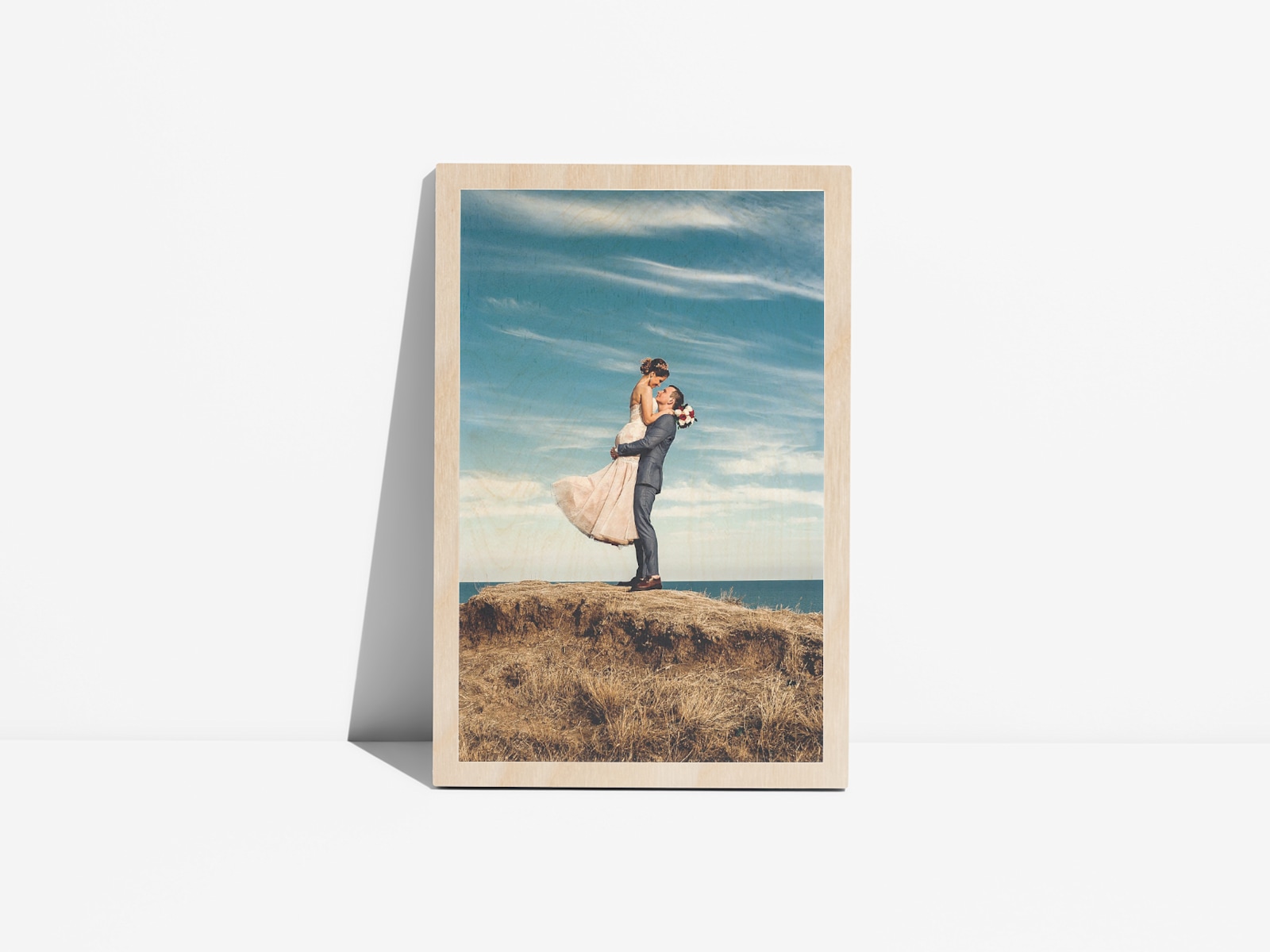 Larger version: A tabletop wood print featuring a photo of a couple on their wedding day. 