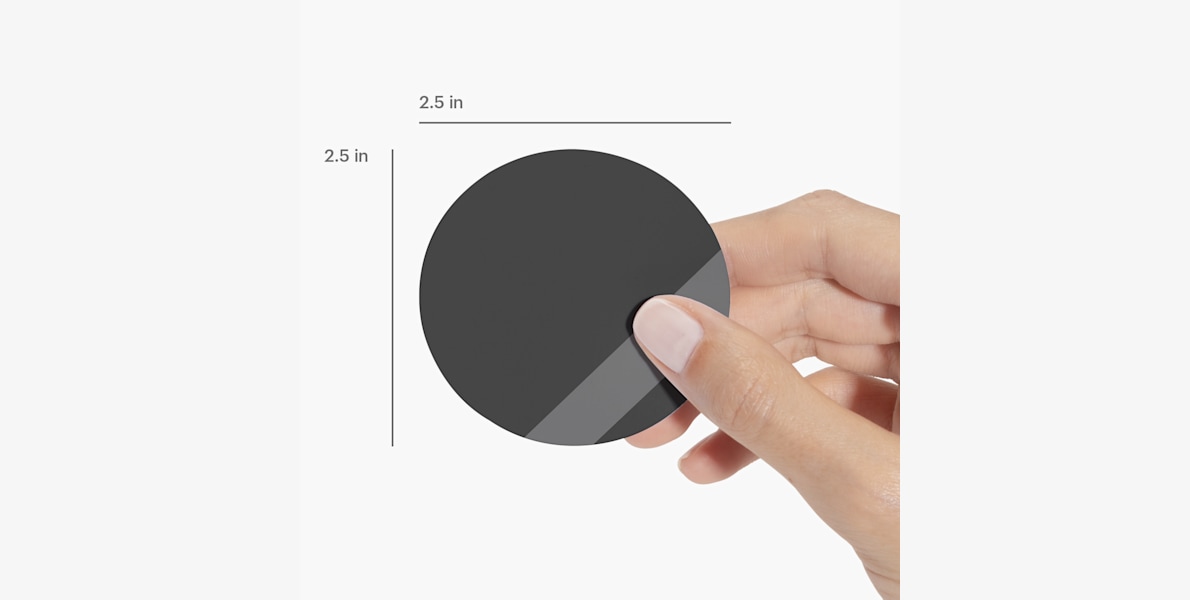 A person holding a circle business card, labeled by its size.