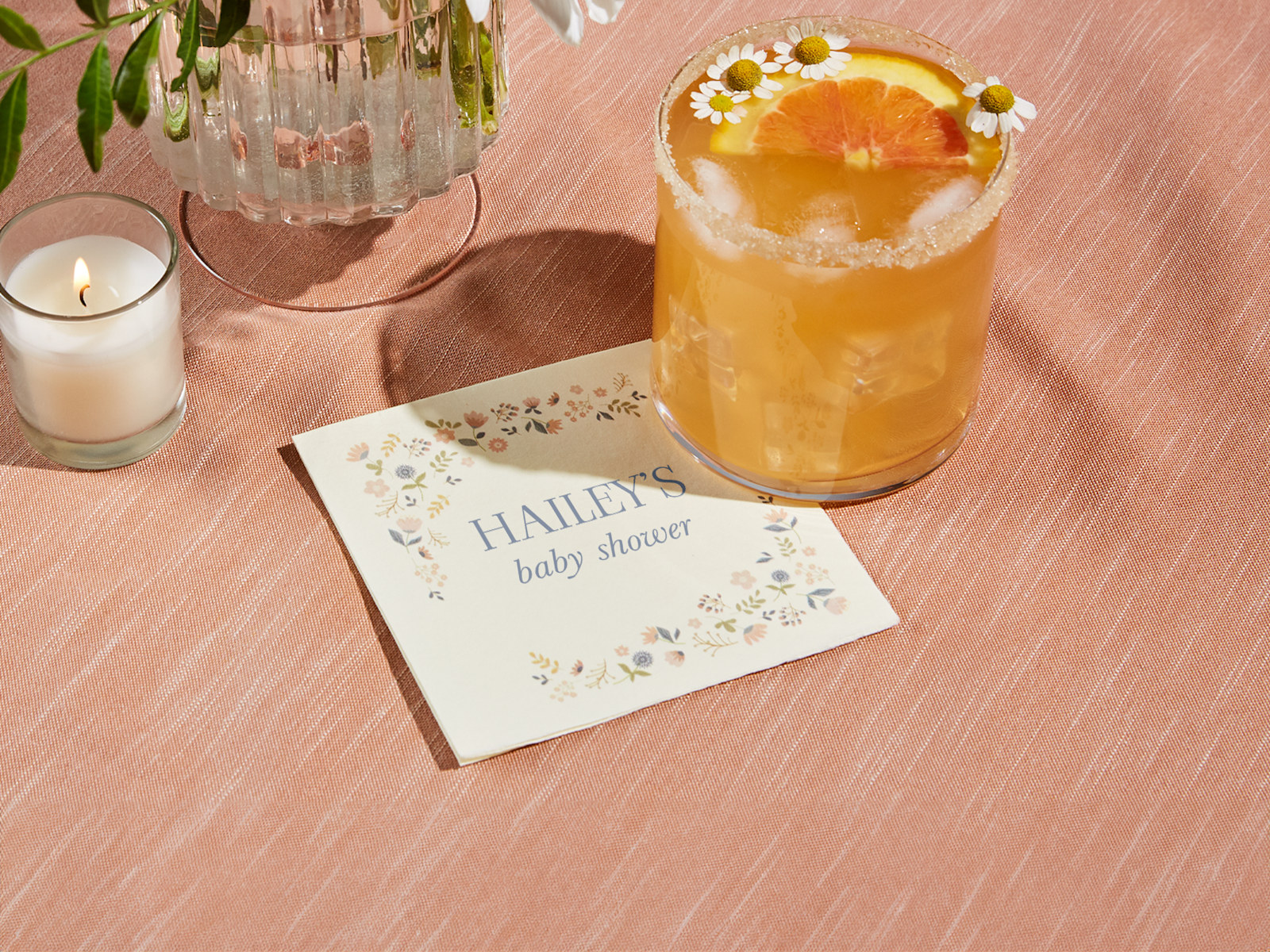 A cocktail napkin personalized for a baby shower. 