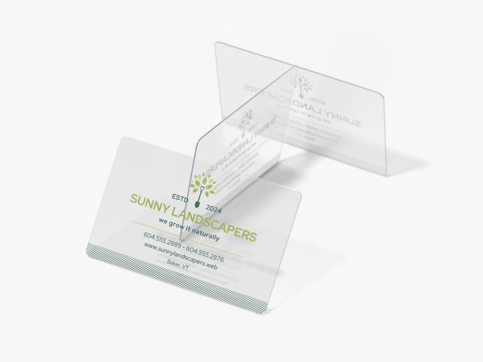 Larger version: A stack of clear plastic business cards for a landscaping business.