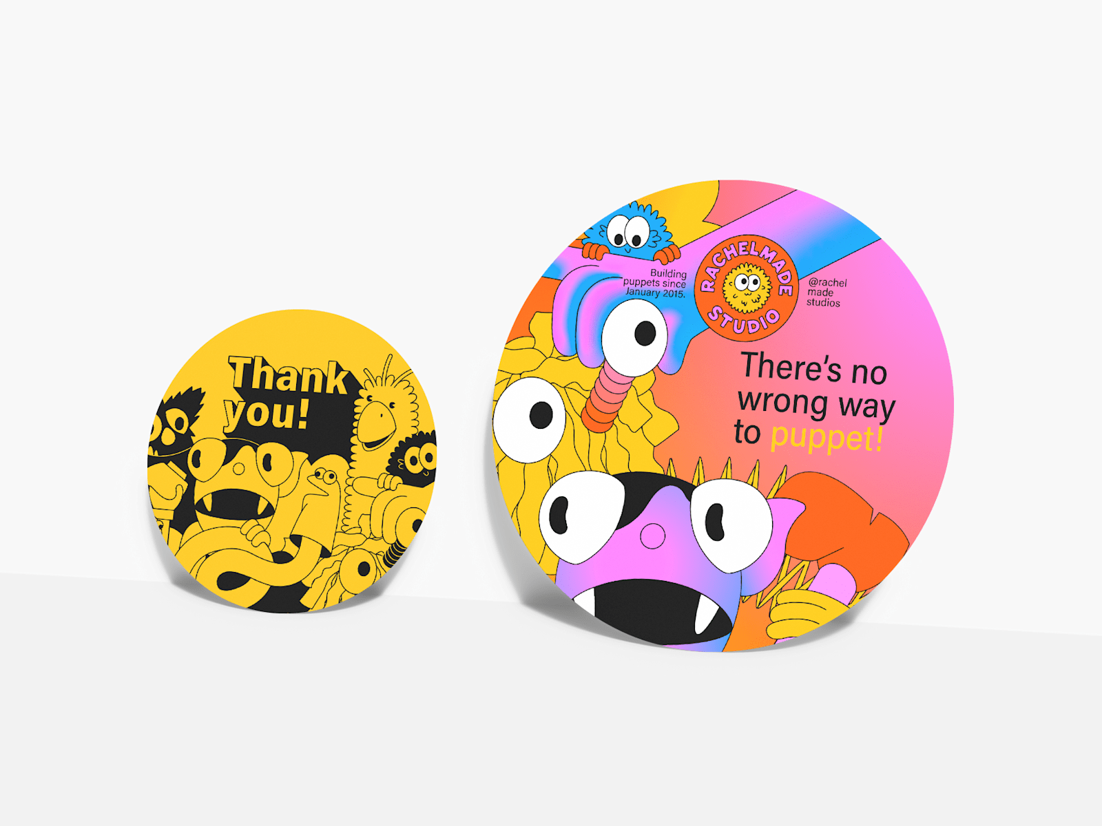 Two different sizes of circle-shaped postcards, custom-printed for a puppet studio.