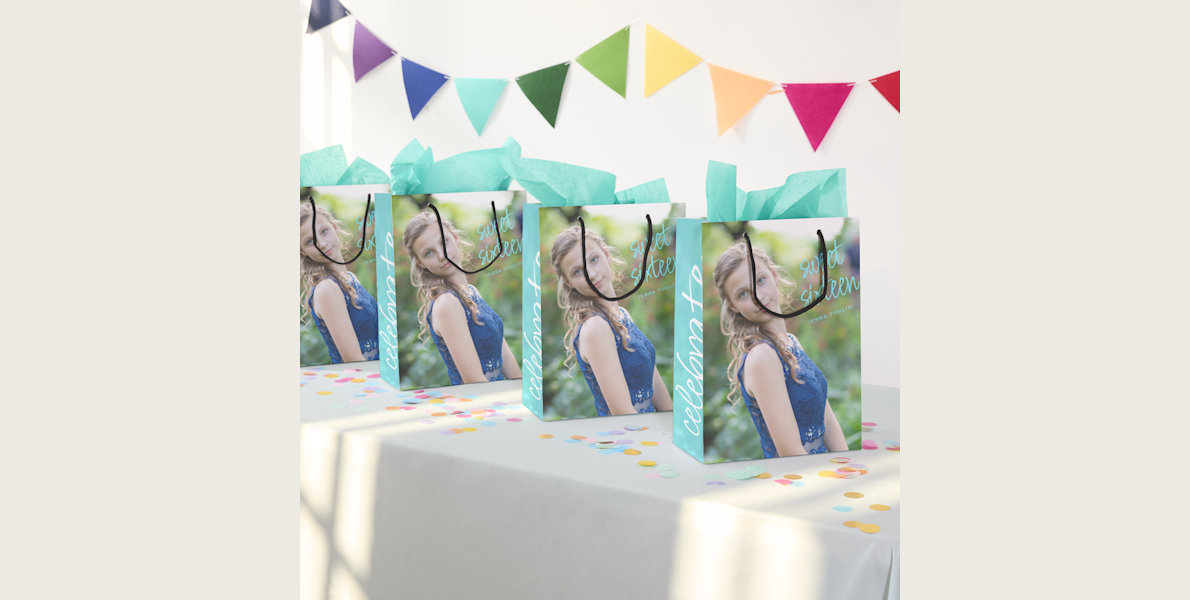 Shows an array of multi-coloured bags spread out like a fan with the words Tennis Club printed on them. 