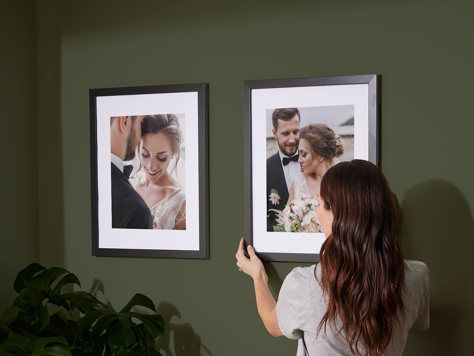 Larger version: Two framed prints hung on a wall, both featuring wedding photos. 