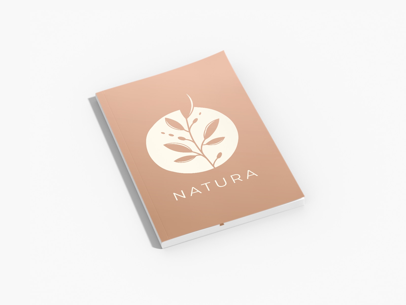 A personalized journal with the business name Natura written on the cover.
