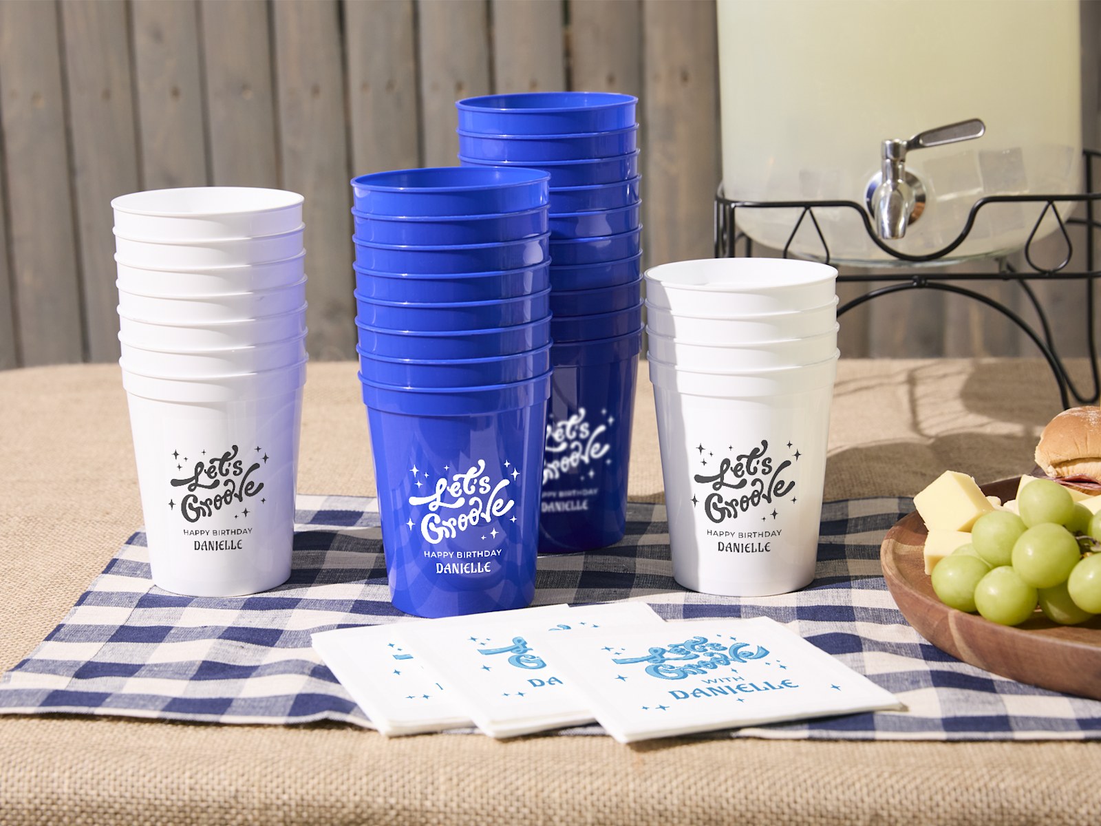 Larger version: Custom stadium cups stacked on a party table, personalized with the message, “Let’s groove.”