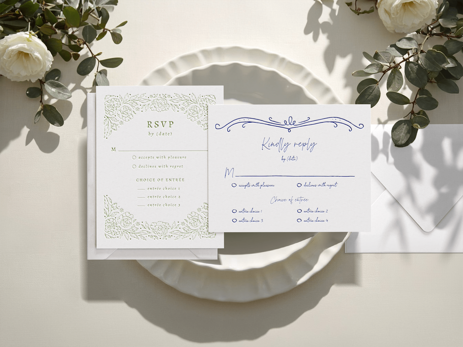One vertical letterpress RSVP and one horizontal letterpress RSVP with various decorative details. 