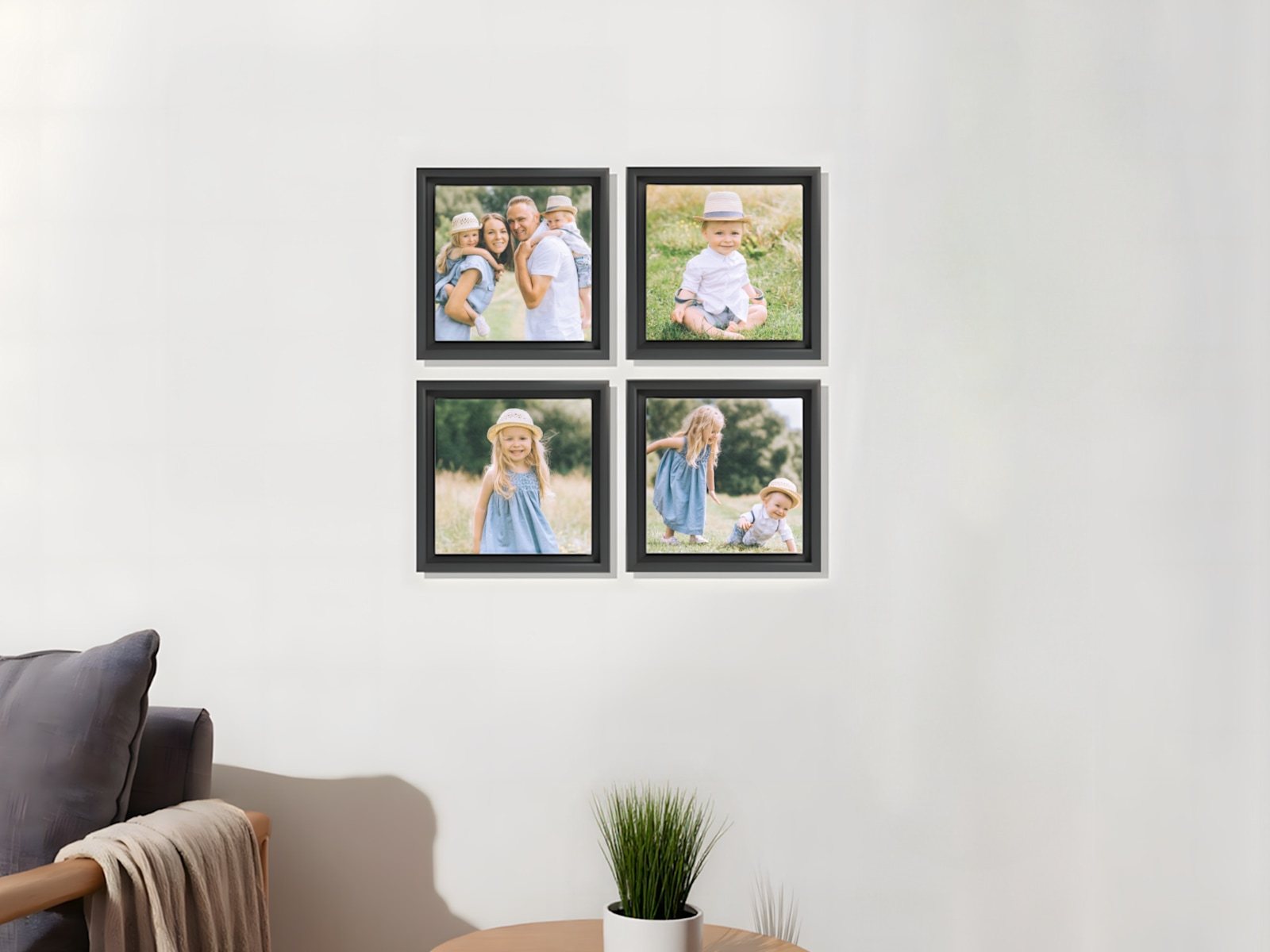 Larger version: Four framed canvas prints of a family hanging on a living room wall. 