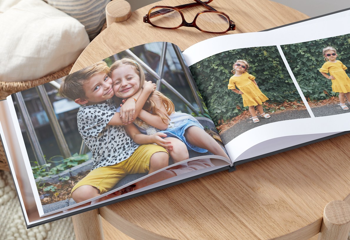 photo book with picture of two young children hugging