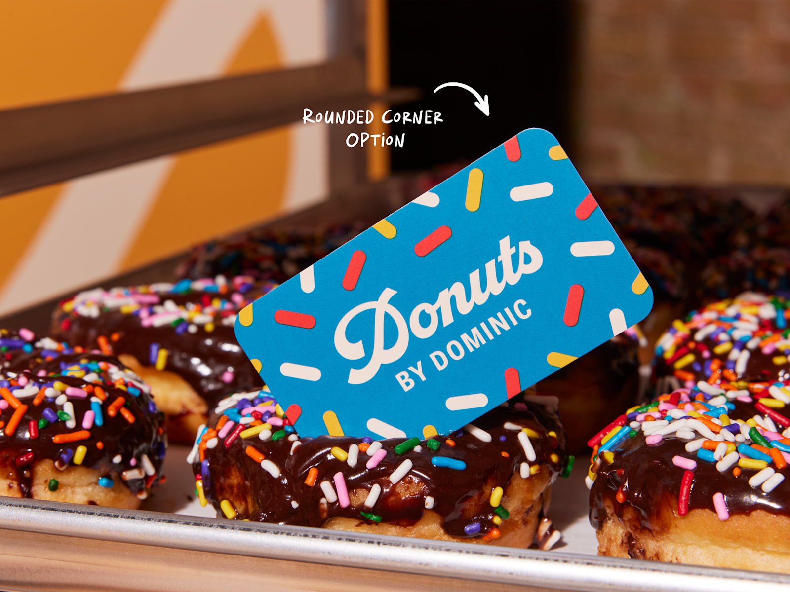 A business card promoting a donut shop.