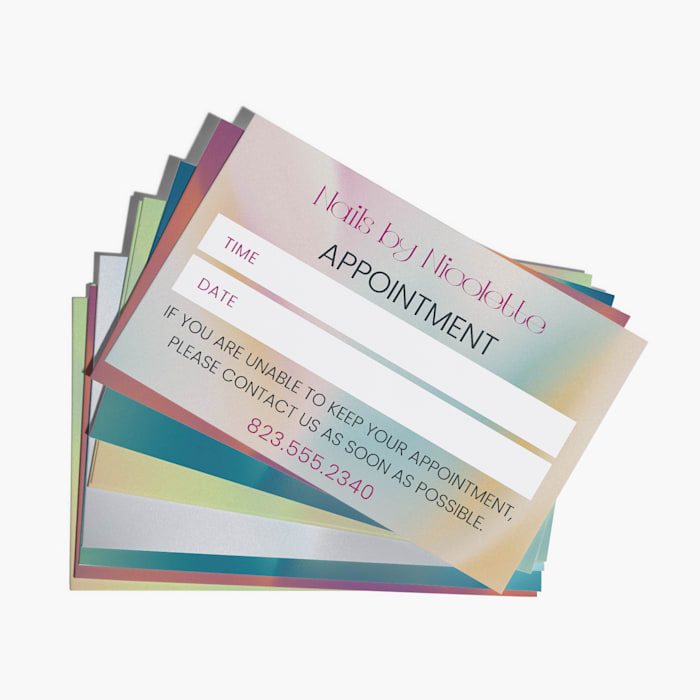 A stack of appointment reminder cards for a nail salon.