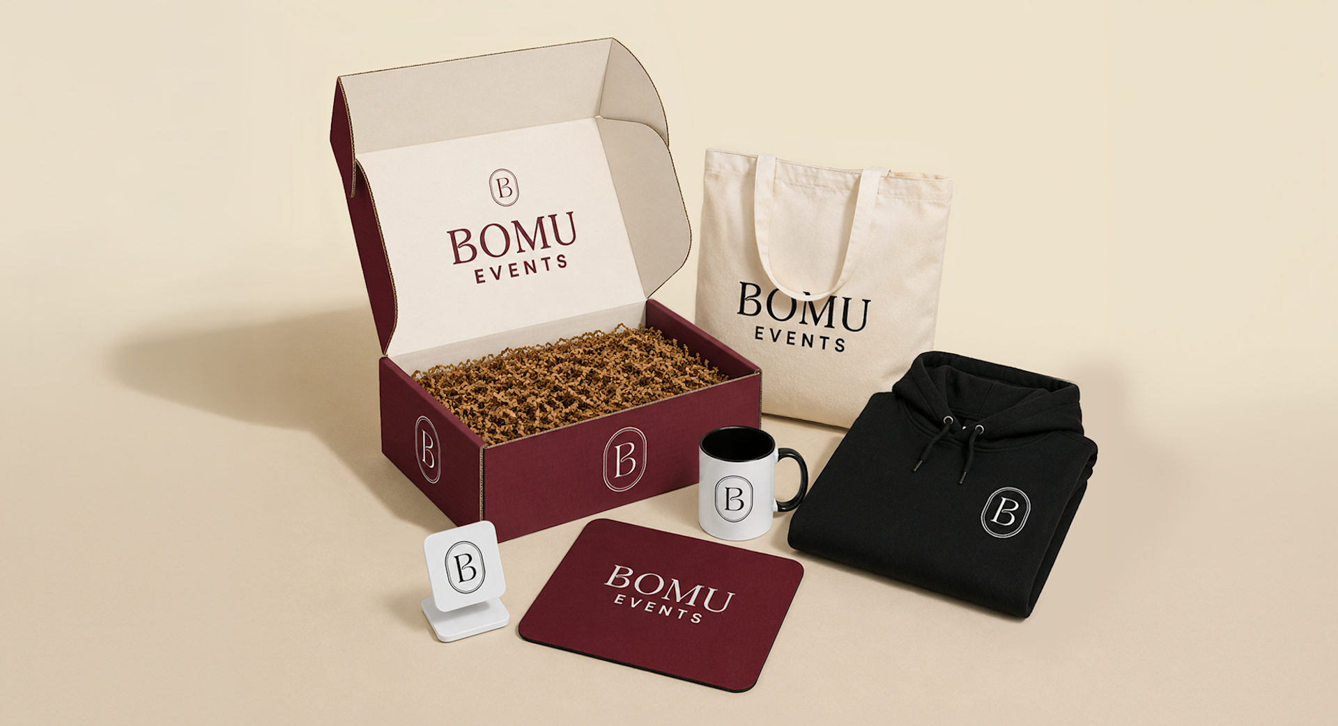 A flat-lay display of personalized merchandise items displayed next to a mailer box. 