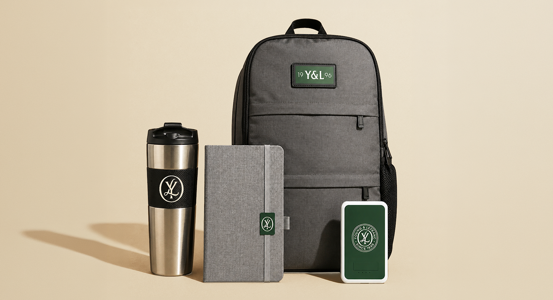 A professional backpack standing upright alongside branded swag, featuring a business logo. 